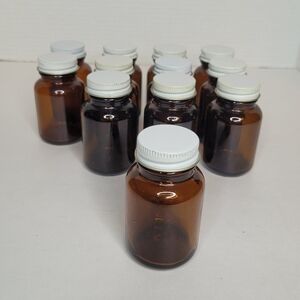 Twelve Amber Color Glass Apothecary Bottles with Metal Screw Tops
